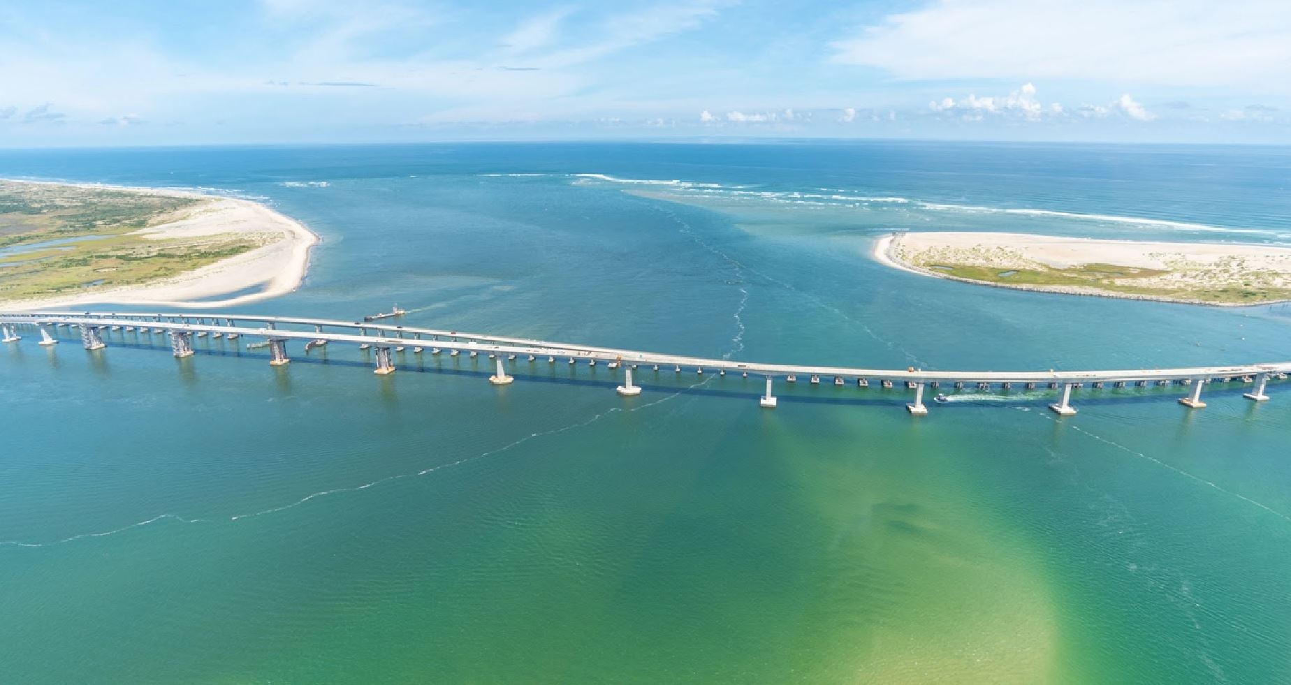 Aerial view of Oregon Inlet with the Marc Basnight Bridge completed