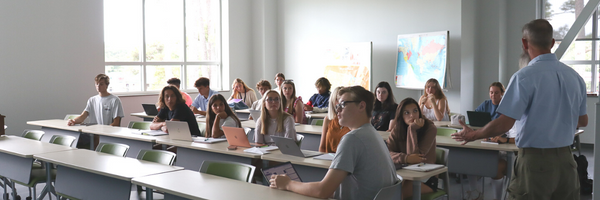 Image of a classroom full of students inside the COA Dare Campus.