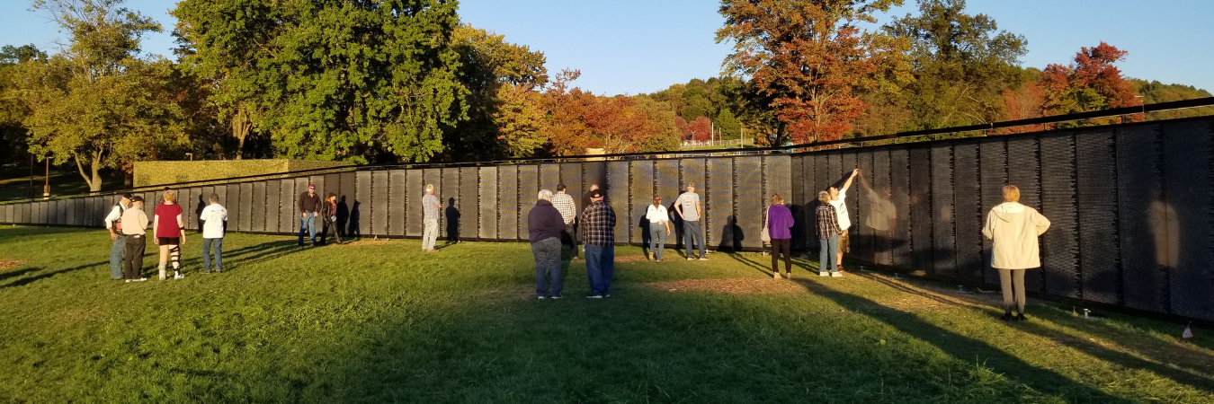 Image of attendees at The Wall That Heals on a sunny day.