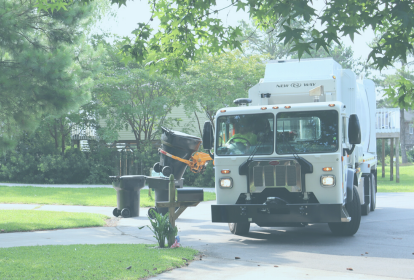 Image of a Dare County trash truck collecting trash