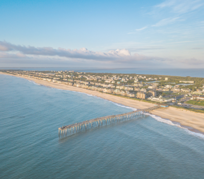 Aerial image of the Outer Banks featuring a pier.