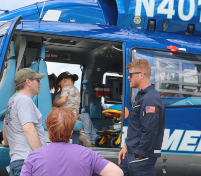 Image of adults and children touring the Dare MedFlight helicopter.